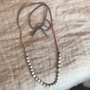 Adjustable necklace with suede ties